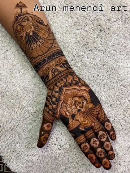 A unique design with a focus on a single hand, featuring a groom on a horse for the baraat and a Radha-Krishna portrait.