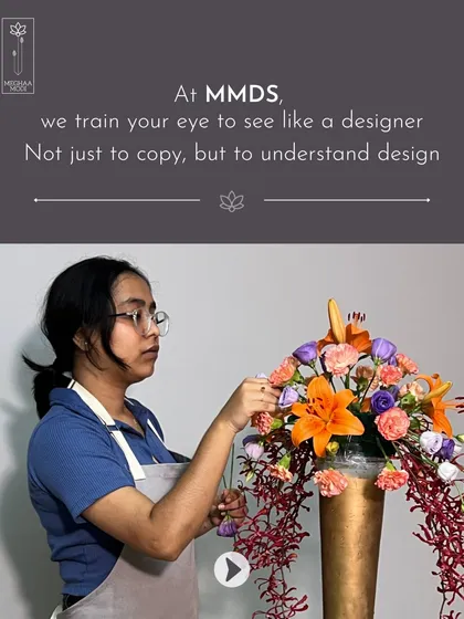 Here, a student is learning to compose a vibrant arrangement with cascading elements. I teach my students to understand design, not just copy it, so they can develop their own unique style.