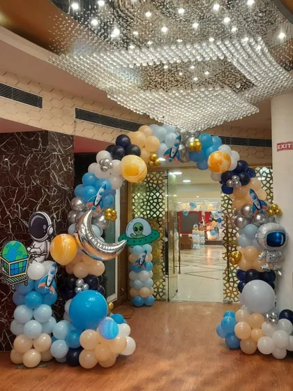 Blast off into an unforgettable celebration with our space-themed balloon arch. This grand entrance, complete with astronaut and rocket ship foil balloons, sets the stage for an out-of-this-world party adventure.