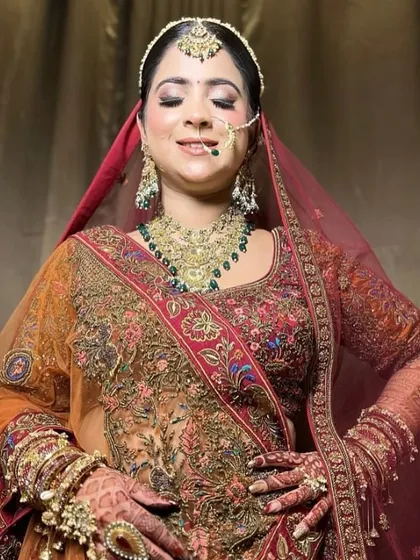 A joyful moment captured, with the bride looking confident and happy in her full wedding attire.