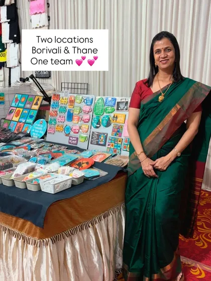 Two locations, one team. A shot of me at my stall, ready to welcome customers. The display behind me showcases a variety of my hand-painted decor.