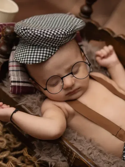 A dapper little man! This three-month chubby baby session has a fun, vintage theme with a newsboy cap and tiny glasses.