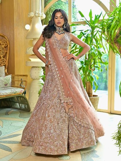 This bride is the epitome of grace and style. Her glamorous makeup and hair perfectly match the elegance of her reception attire.