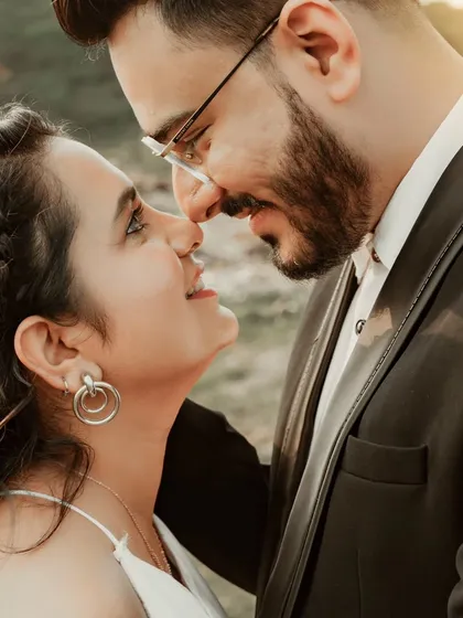 A close-up portrait filled with adoration and genuine smiles. This candid shot captures the sweet, loving glances that couples share when they think no one is watching.
