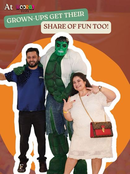 At Wooray, grown-ups get their share of fun too. This photo captures parents enjoying a moment with the Hulk mascot, showing that our parties are designed for family-wide entertainment.
