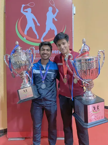 Big trophies for big wins. Our players celebrating their silver medal victory at the All India Inter-University Squash tournament.