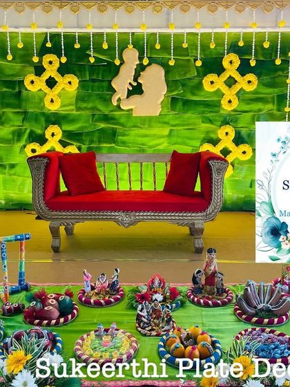 A simple and sweet baby shower setup with a green and yellow theme. The mother and child cutout in the background adds a personal touch to the decor.