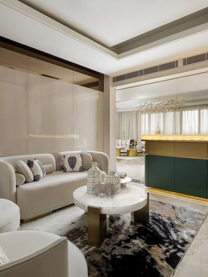 This view shows the family lounge and its connection to the bar area. We used a deep green and gold color scheme for the bar to create a distinct yet connected zone, while the lounge remains soft and neutral.