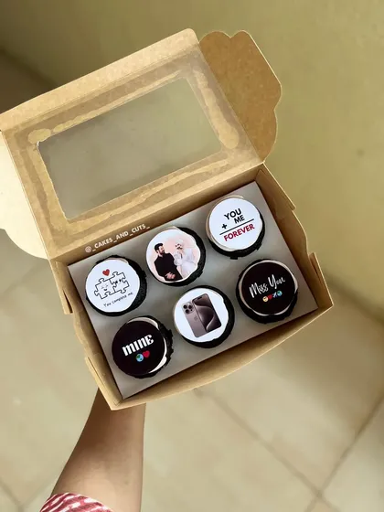 A box of six cupcakes with custom edible toppers, perfect for telling a personal story or celebrating inside jokes.