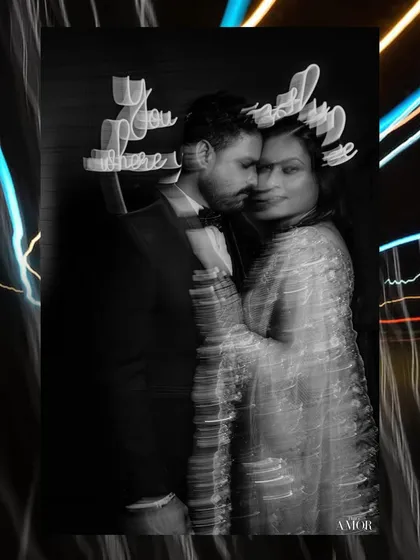 An abstract black and white portrait with motion blur and light streaks. This experimental technique creates a dreamy, ethereal quality, perfect for artistic wedding photography.