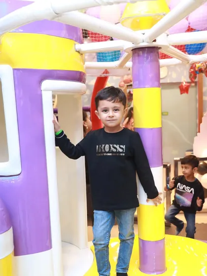 This young man is posing like a boss inside our rocket ship play structure. It’s a great spot for imaginative, space-themed adventures.