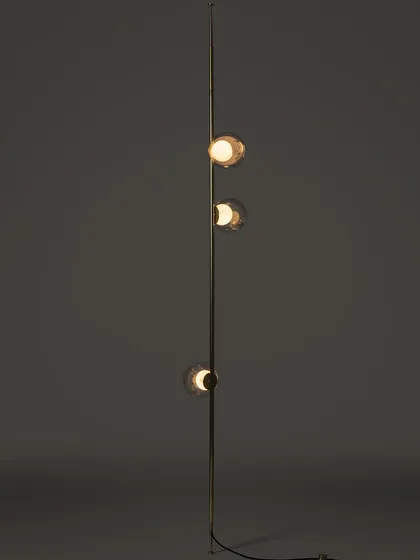 A full-length studio shot of a vertical Bocci stem, highlighting its sleek form and the arrangement of the glass pendants.