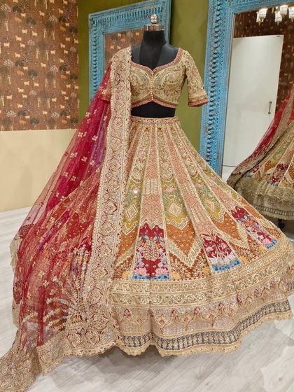 This shot showcases the stunning bridal lehenga with its matching embroidered dupatta. Seeing the complete set helps you envision your full bridal look.