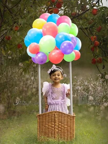 Taking the fun outdoors, this whimsical hot air balloon setup creates a magical scene for a child's birthday photoshoot. I can arrange for unique props and beautiful park locations in and around Pune.