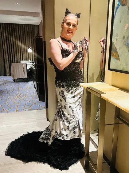 A full-length view of the stunning masquerade ball gown I styled for my client, Ruth. The dress featured a dramatic ruffled train that made her feel like she was at the ball.