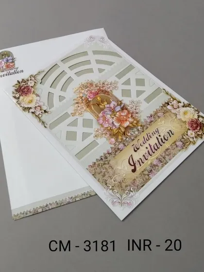 A simple and affordable invitation with a laser-cut window pattern and 3D floral details. This card offers an elegant look on a budget.