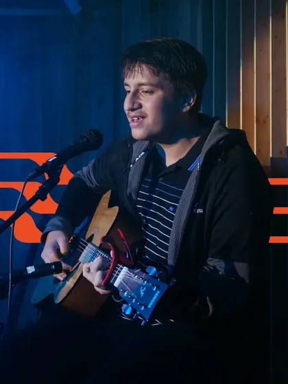 A student singer-songwriter sharing his music. We encourage originality and help students develop their own voice.
