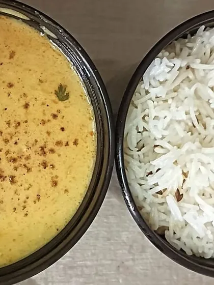 A half-and-half bowl of Kadi and Jeera Rice. The jeera in the rice adds a lovely aroma and flavor that complements the kadi.