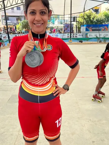 A happy moment with my two silver medals at the 60th National Championships. It's a privilege to compete alongside my students and bring home medals for our state.