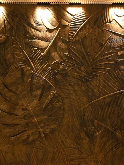 Wall-washing lights bring out the incredible texture of this carved wooden panel. This is a perfect example of how I use light to enhance art and architectural features.