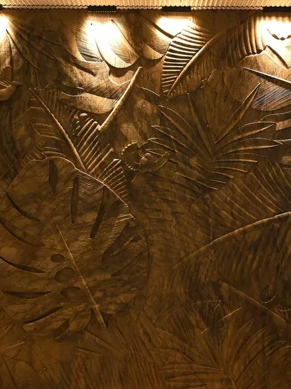 Wall-washing lights bring out the incredible texture of this carved wooden panel. This is a perfect example of how I use light to enhance art and architectural features.