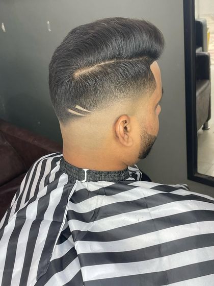 A side view of the double-line design on a high fade, blending seamlessly with the voluminous top.