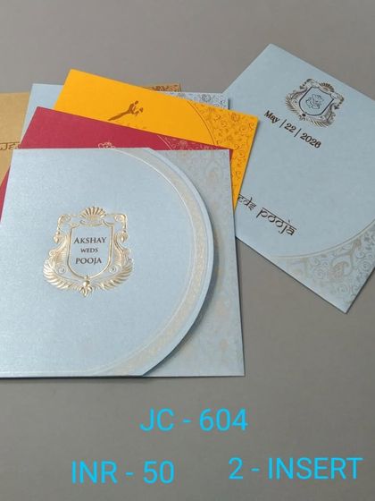 A simple and stylish invitation with a unique semi-circular flap. The set is available with inserts in multiple colors to match your wedding's theme.