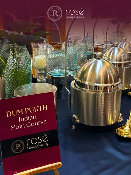 Our Dum Pukht Indian Main Course station, elegantly set up with traditional serveware. We bring the art of slow cooking to your events, where rich flavors and aromatic spices create culinary magic.