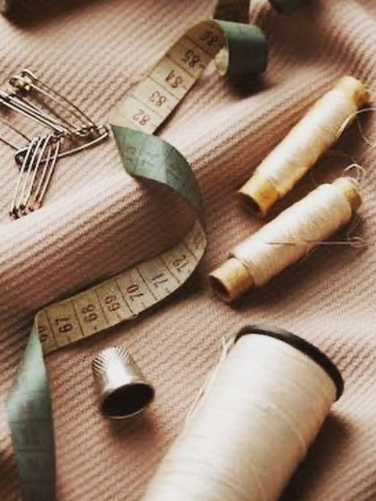 The tools of my trade: thread, needles, measuring tape, and scissors. These simple items are what allow us to create garments of exceptional quality and fit.