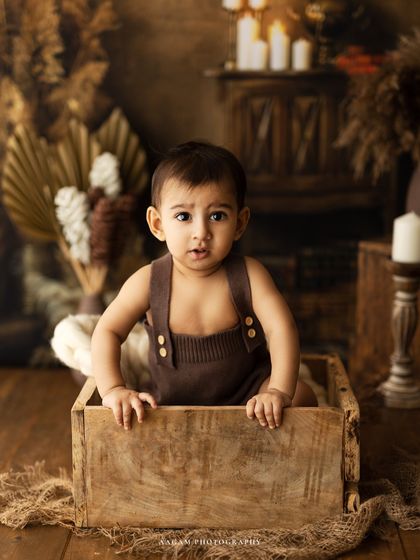 Peeking over the box again. These playful shots are always a favorite with parents.