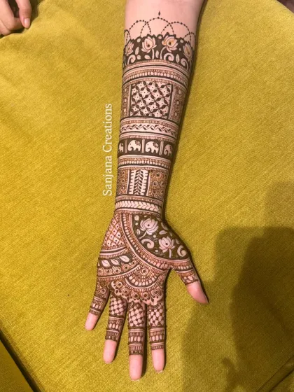 A close-up of one arm, showing the detailed line work and shading in this festive design.