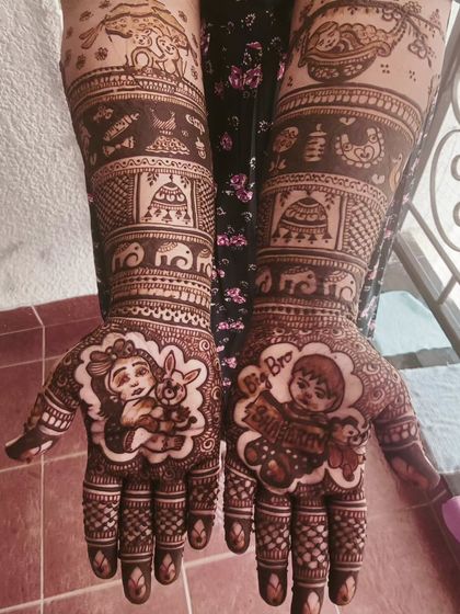 I love doing cartoon-style figures for baby showers! This design features cute baby characters with their toys, surrounded by traditional motifs like elephants and decorative bands.