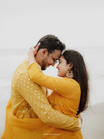 A close, intimate embrace that captures the deep affection and happiness between the couple during their beach pre-wedding session.