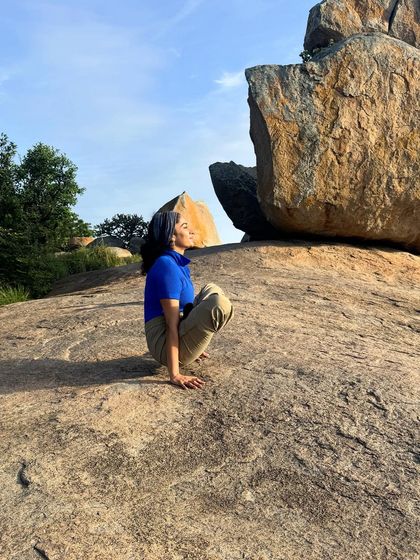 A moment of stillness in Malasana (Garland Pose) on the rocks of Uttari Betta. Grounding down into the earth is a powerful feeling.