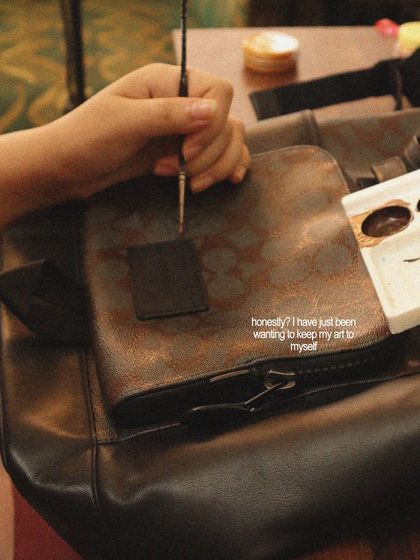 Here I am working on a custom design for a TUMI bag. For this project, I painted designs inspired by different Indian cities, turning a travel essential into a piece of art.