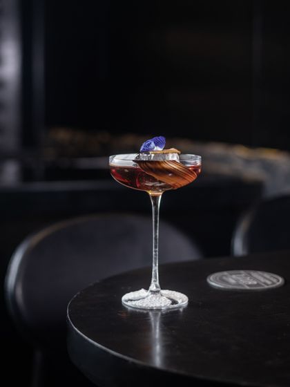 Inspired by the hills of South India, our 'Nilgiri' cocktail features Smoky Whiskey, coffee, and lavender milk with vermouth. It has a smooth, buttery finish with a distinct lavender nose.