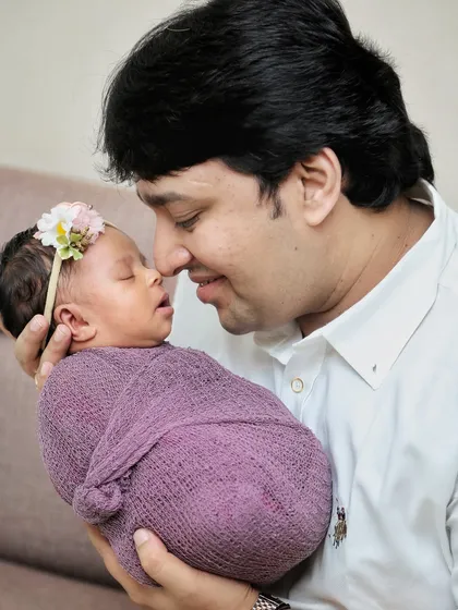 A father's loving gaze at his newborn baby. These close-up shots capture the powerful connection and tenderness of a new dad.