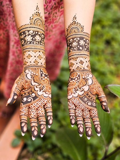 A stunning design with bold, dark floral patterns on the arm.