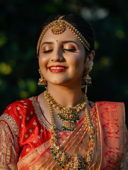 The happy smile of a bride on her big day. This close up shows the flawless HD makeup finish, perfect for wedding photography.