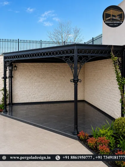 A classic, ornate black metal gazebo. The detailed ironwork and elegant columns make this a timelessly beautiful addition to any formal garden or patio space.