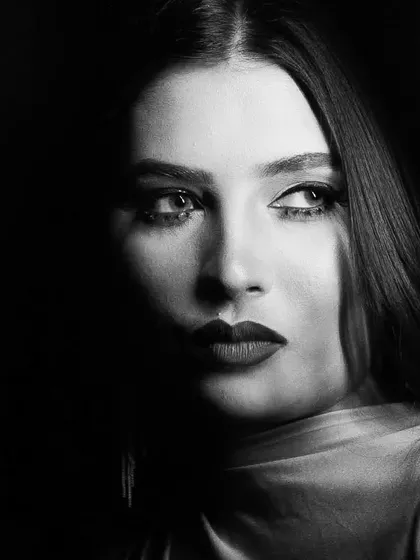 The play of light and shadow is crucial in black and white photography, a key concept in my media makeup course.