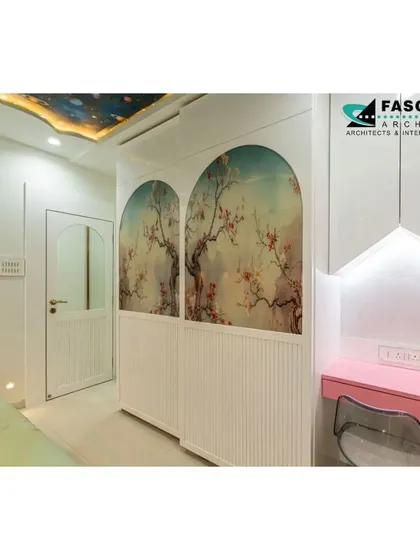 A closer look at the custom wardrobe in the kids' room. The doors feature beautiful arched panels with artistic floral prints, adding a touch of whimsy and elegance to the space.
