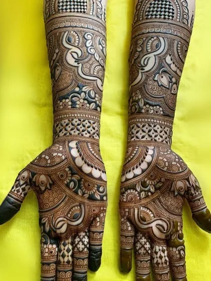 An example of my intricate pattern work, this full-hand design uses a combination of geometric shapes, delicate paisleys, and floral motifs. The contrast between fine lines and filled spaces creates a rich, three dimensional effect.