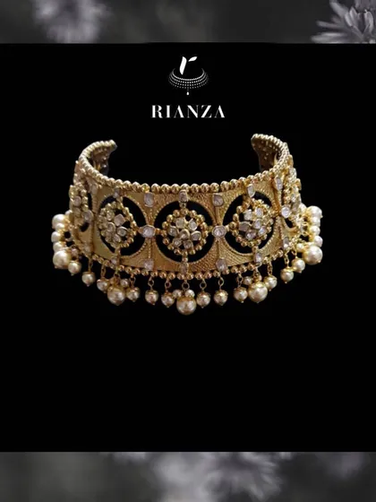 A detailed look at the Rajwadi choker. The piece is handcrafted with intricate metalwork, polki-style stones, and delicate pearl drops, reflecting royal Rajasthani aesthetics.