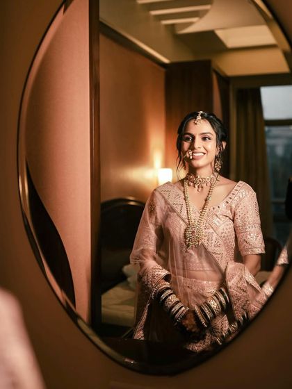 A reflection of beauty. This artistic shot captures the bride's minimal yet stunning look as she gets ready for her Phera ceremony.