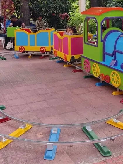 All aboard the Happy Train. This colorful track train is perfect for toddlers and young children, and we can set it up on any flat surface, including lawns, turf, or indoor flooring.