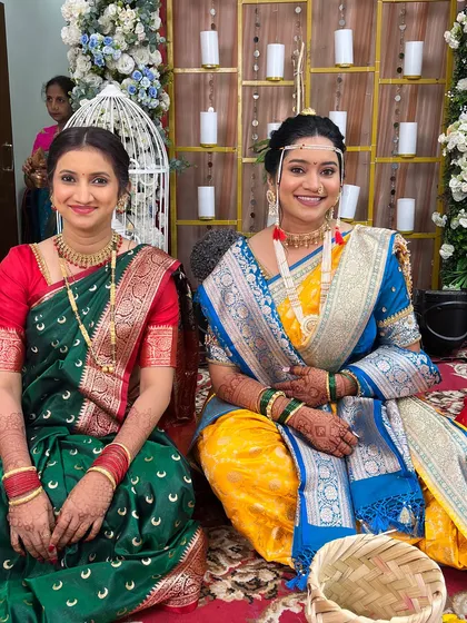 The bride Snehal with a guest, both looking beautiful in their traditional sarees. I also provide makeup services for the entire family.