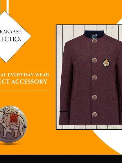 See how our accessories complete a look. This image demonstrates how our hand-painted elephant button and a classic crest brooch can elevate a simple maroon bandhgala jacket, adding a touch of regal sophistication.