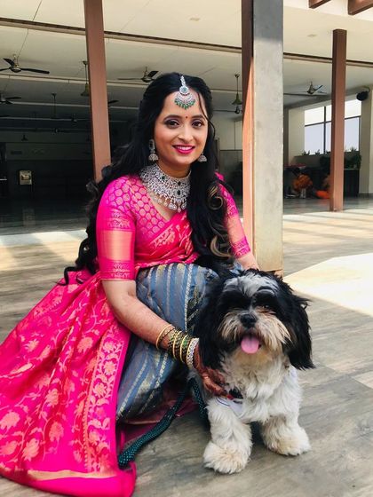 Another adorable shot with her dog. This look, featuring a half-saree with soft curls, is perfect for a bride who wants a blend of tradition and modern style.