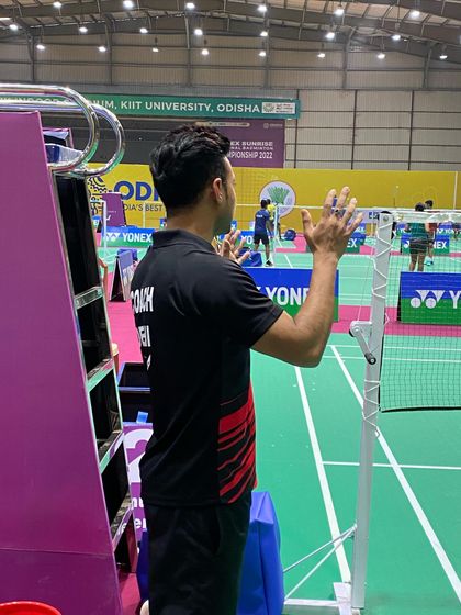 Guiding a player from the sidelines. Clear communication and constant motivation are key parts of my coaching philosophy, especially during competitive matches.